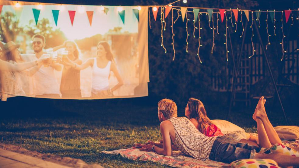 Couple watching movie outdoors